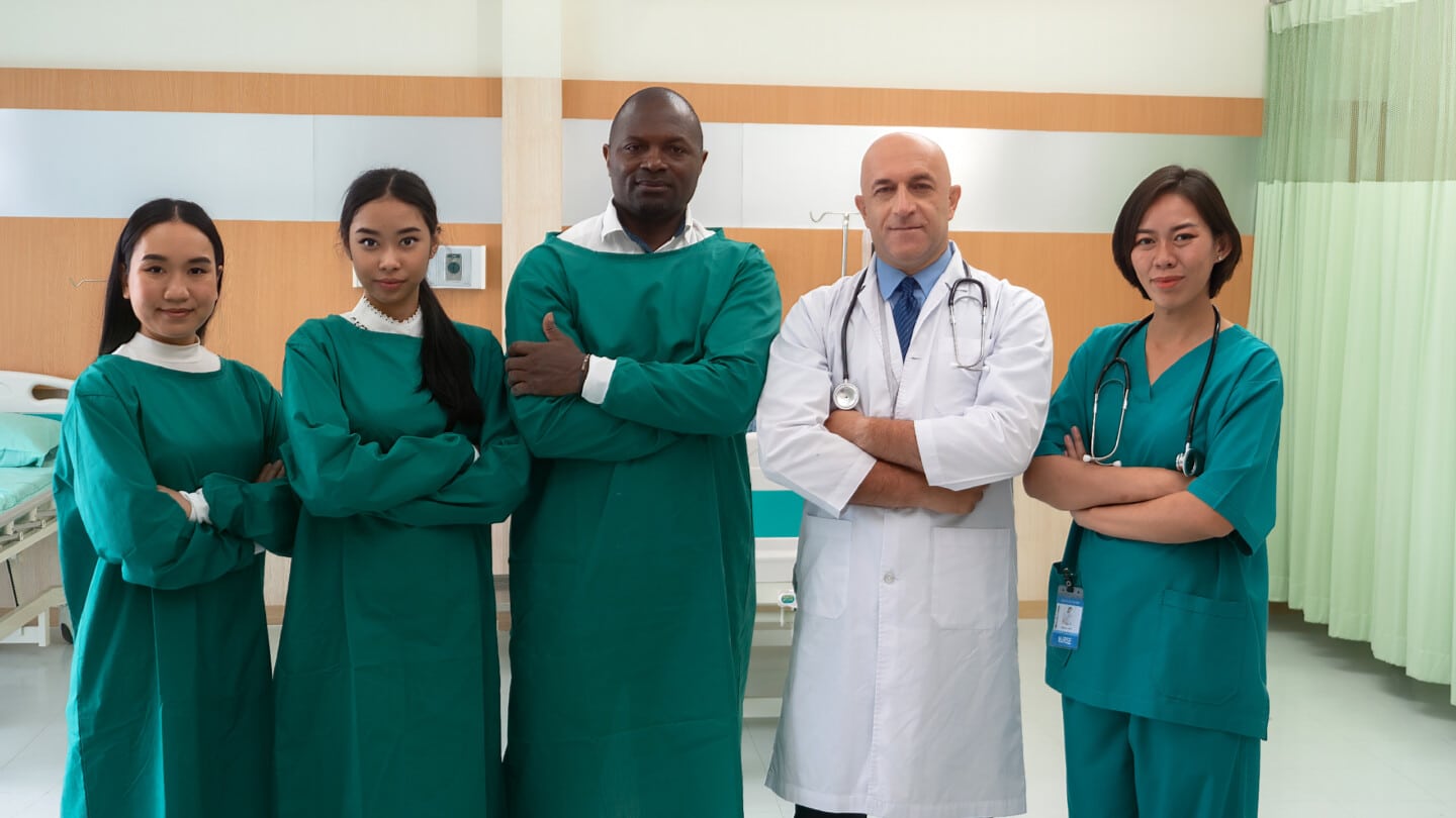 In hospital diversity Doctor standing in line proud pose portrait in front of surgery operation room